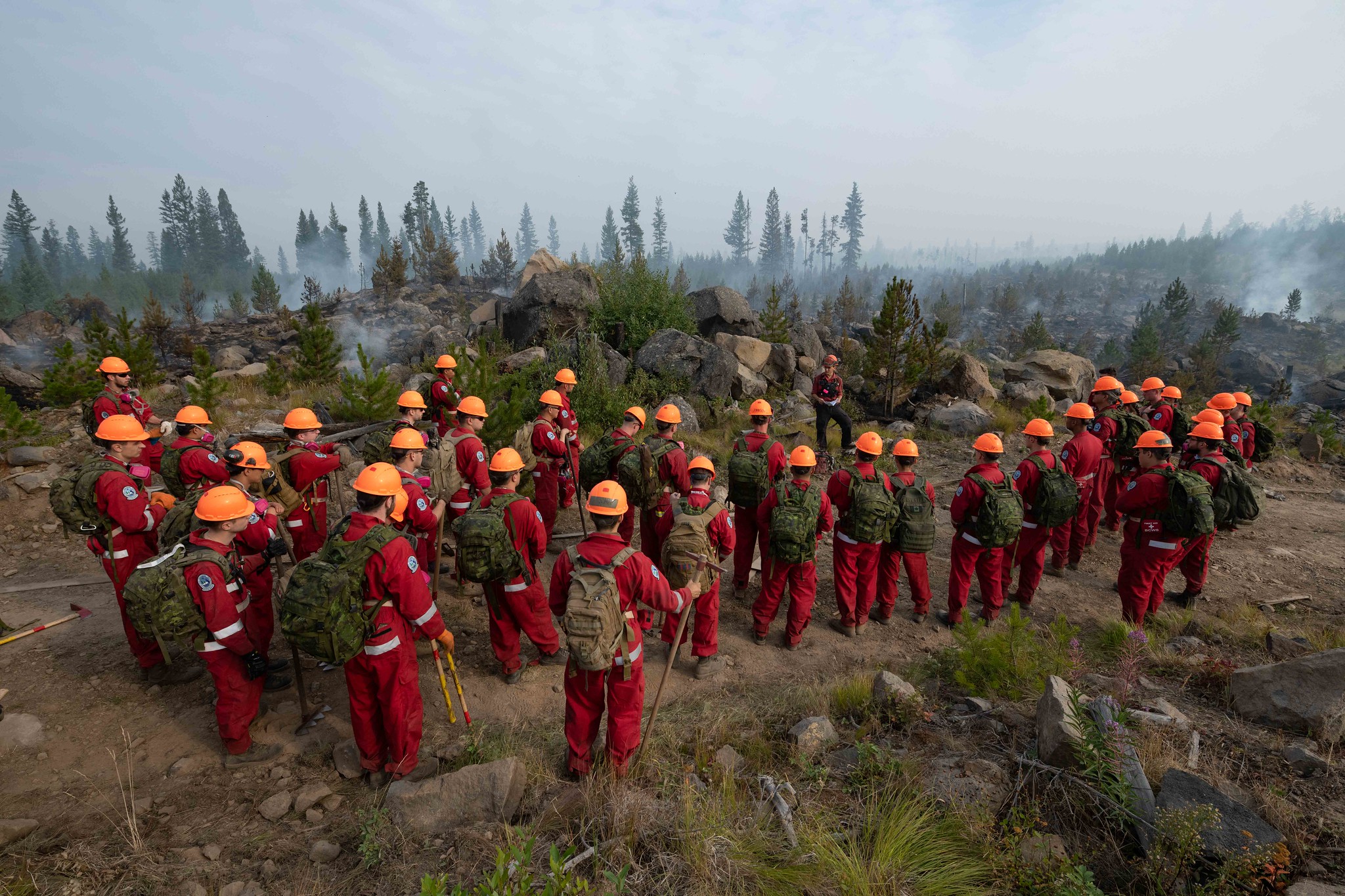 Members of the Domestic Response Company (DRC), Reservists drawn from 38, 39, and 41 Canadian Brigade Groups in Western Canada, conduct Type 3 Firefighting under the supervision of the British Columbia (BC) Wildfire Service at the Flat Lake Fire near 100 Mile House, BC during Operation LENTUS on 18 August 2021.