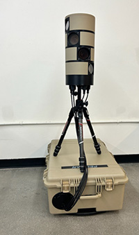 A counter-drone device sitting on top of a carrying case.