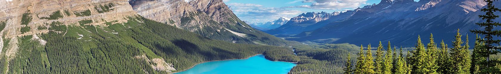 A turquoise lake and the Rocky Mountains.