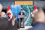 Tab 4: Image of Minister Sajjan delivers remarks at a podium